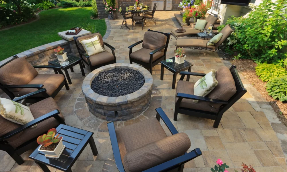 outdoor patio deck with fireplace and chairs